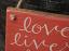 Love Lives Here Wooden Sign, by Our Backyard Studio in Mill Creek, WA