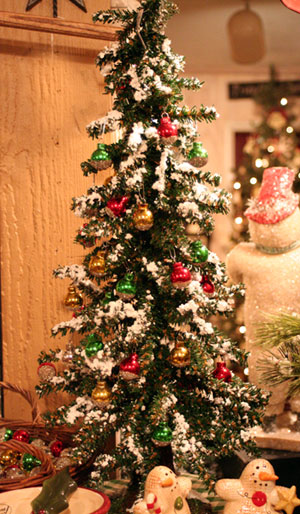 Snowy Pine Tree shown with ornaments