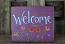 Welcome Sign with Colorful Flowers