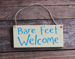 Our Backyard Studio Bare Feet Welcome Sign - Yellow