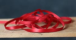 The Weed Patch Red Single Faced Poly Satin Ribbon, 1/4 inch