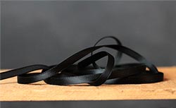 Jet Black Single Faced Poly Satin Ribbon, 1/4 inch